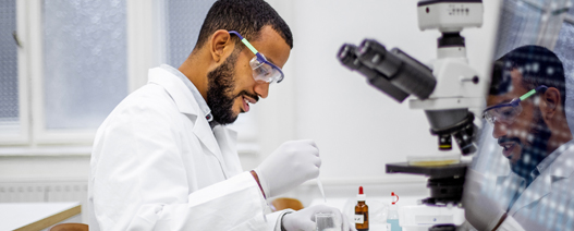 Research performing an experiment in lab