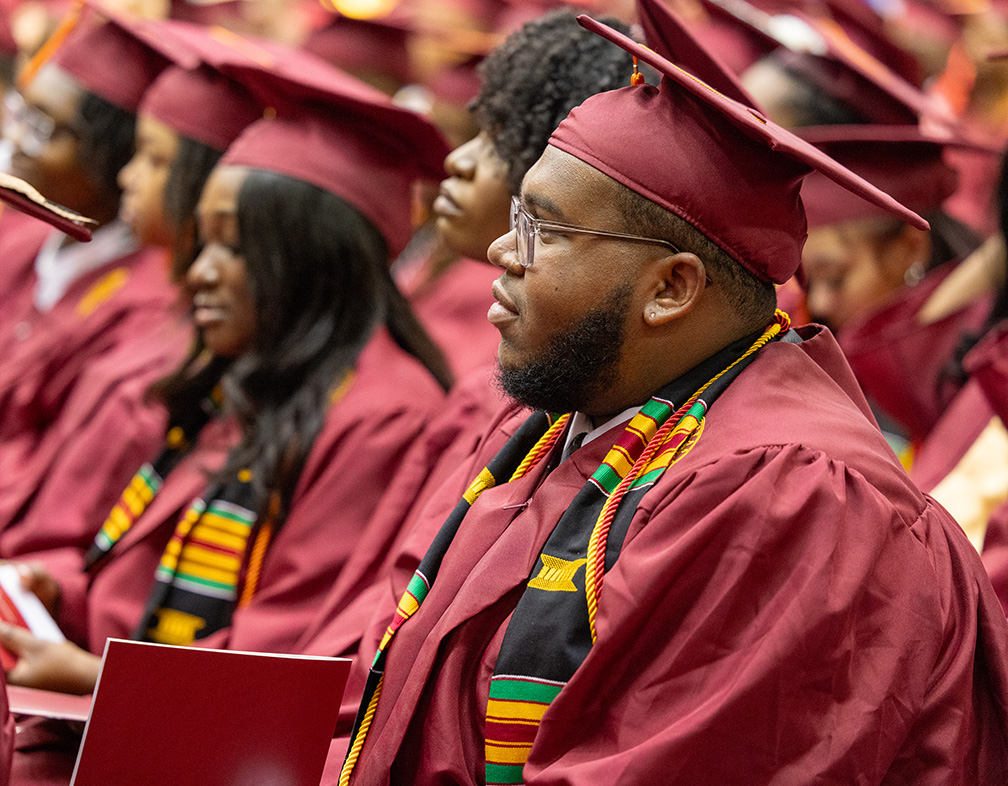 Picture of students in robes at graduation.