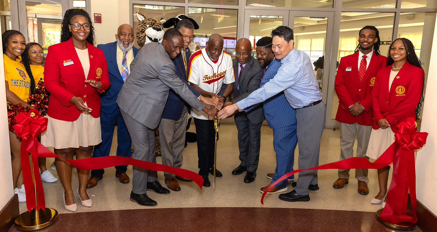 Officials cutting ribbon at grand opening