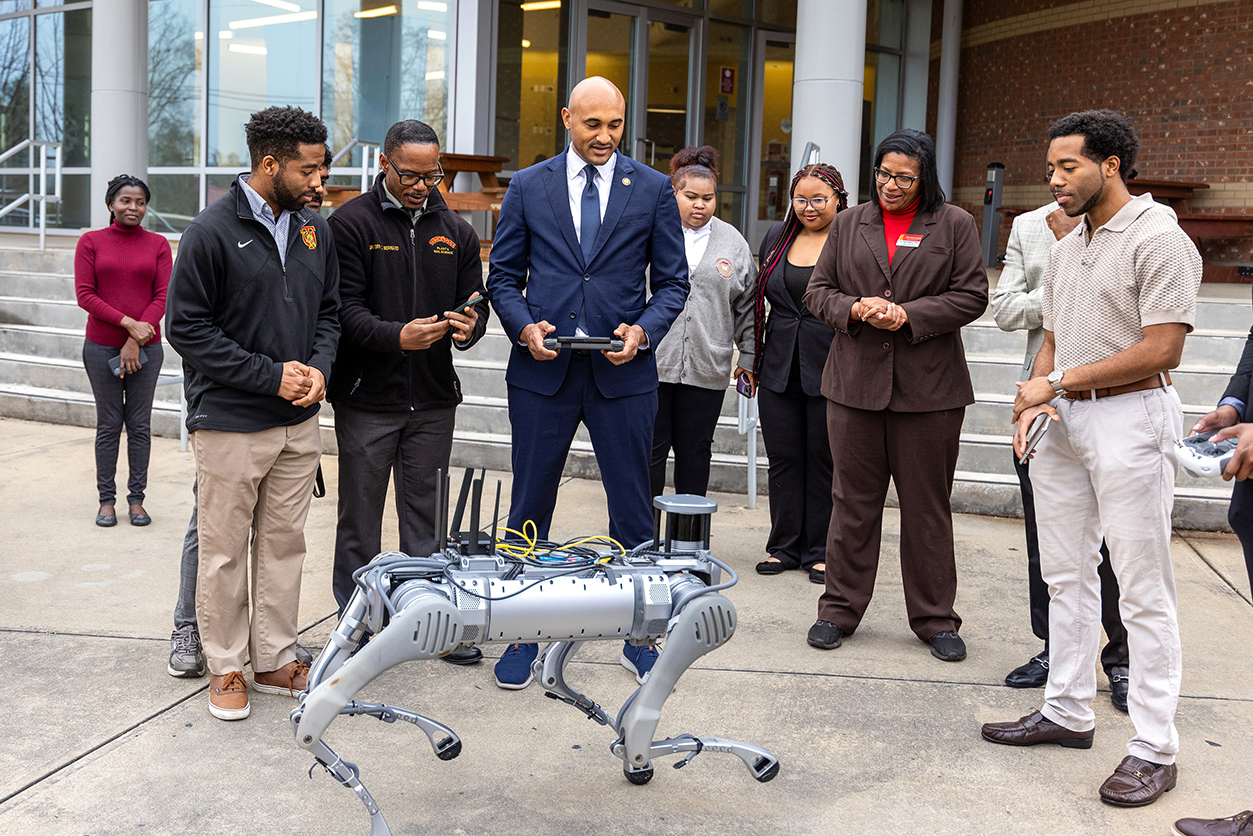 Students demonstrate robotic project to Congressman Figures