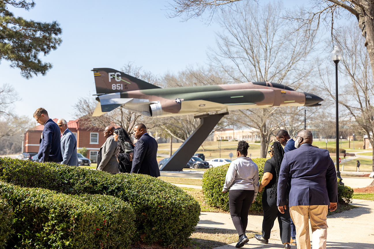 TU officials and Airbus officials walking by the Gen. Daniel Chappie James airplane