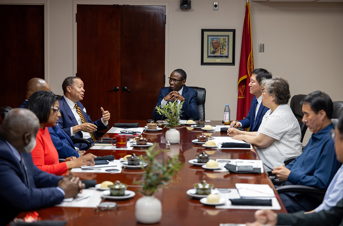 Tuskegee leaders and Samkwang leaders at the conference table