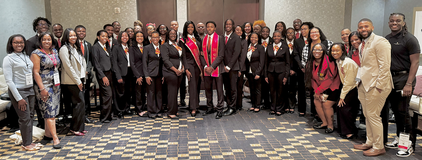 Group photo of students and alumni at the conference