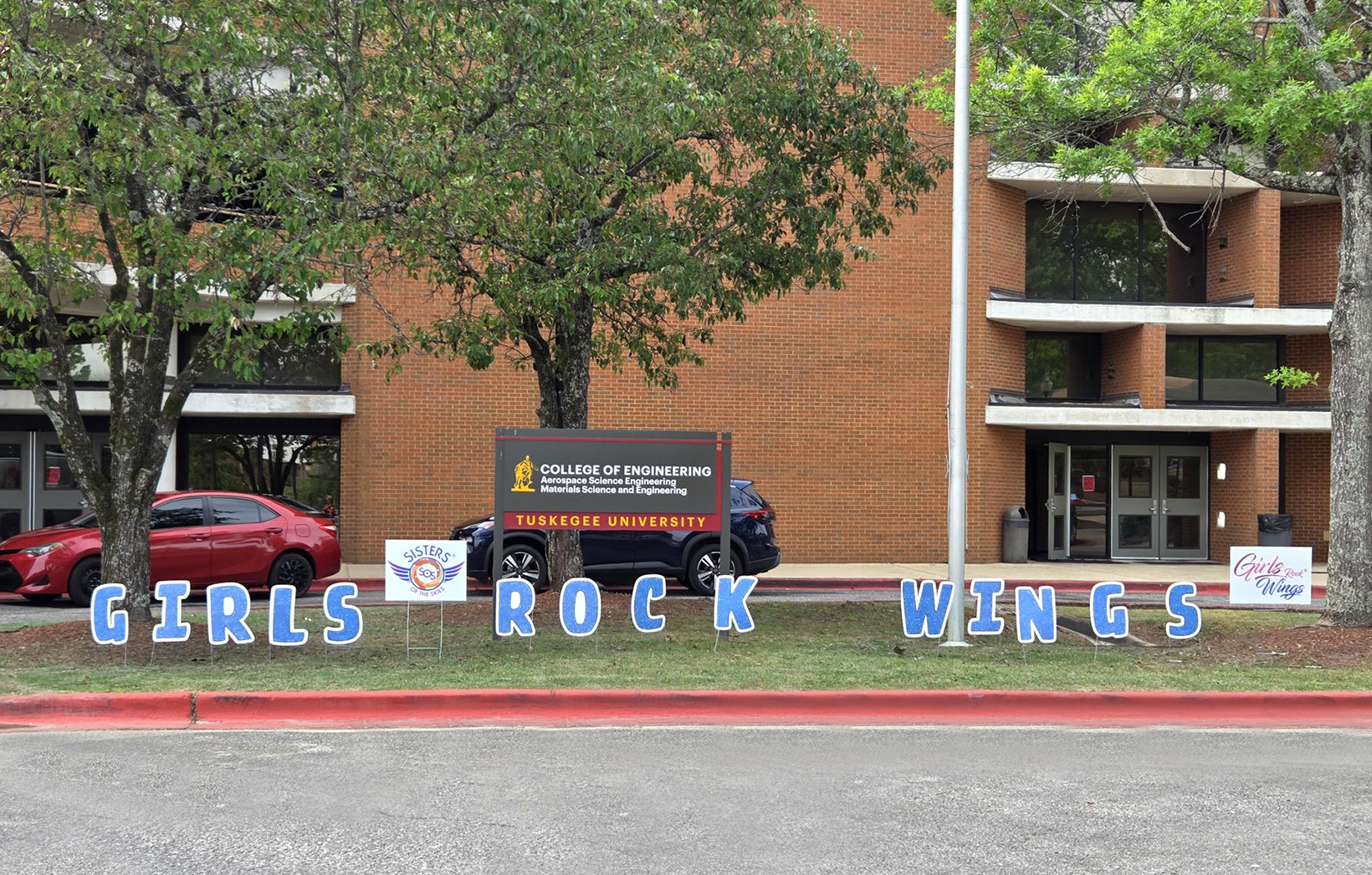 Letters in front of the building to create the sign reading "Girls Rock Wings"