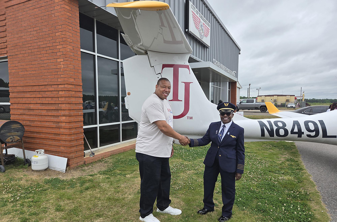 TU Director of the Aviation Degree Program Capt. Titus Sanders and  Retired United Airlines Pilot Theresa M. Claiborne