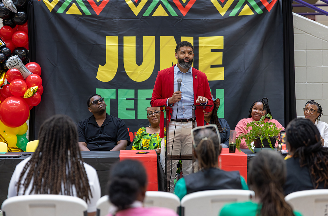 Dr. Rolundus Rice brings greetings during Juneteenth event