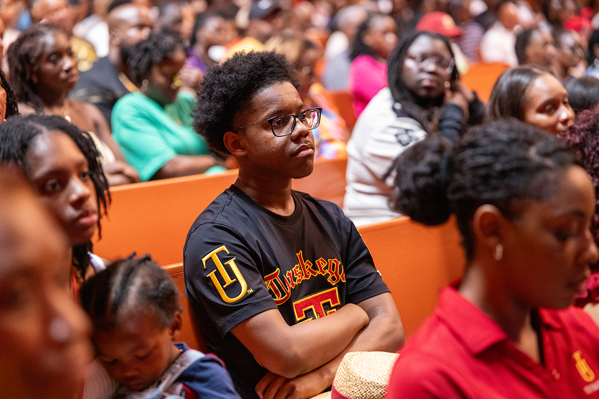 Student in audience listens attentively