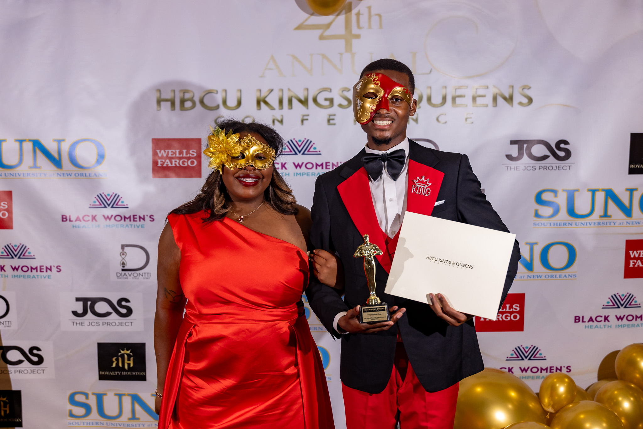 TU King and Queen holding award