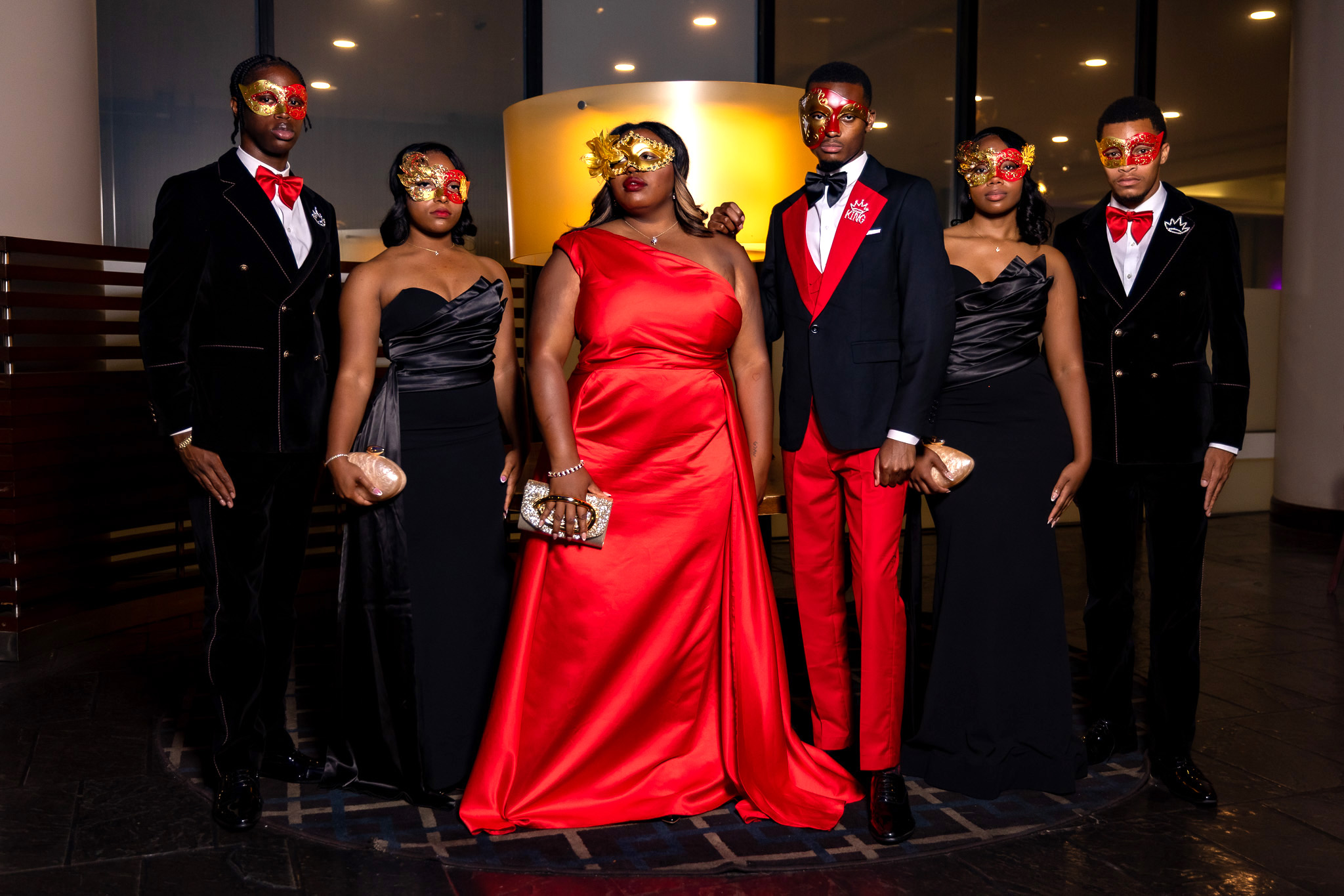 TU Royal Court ready for masquerade ball pose with masks on