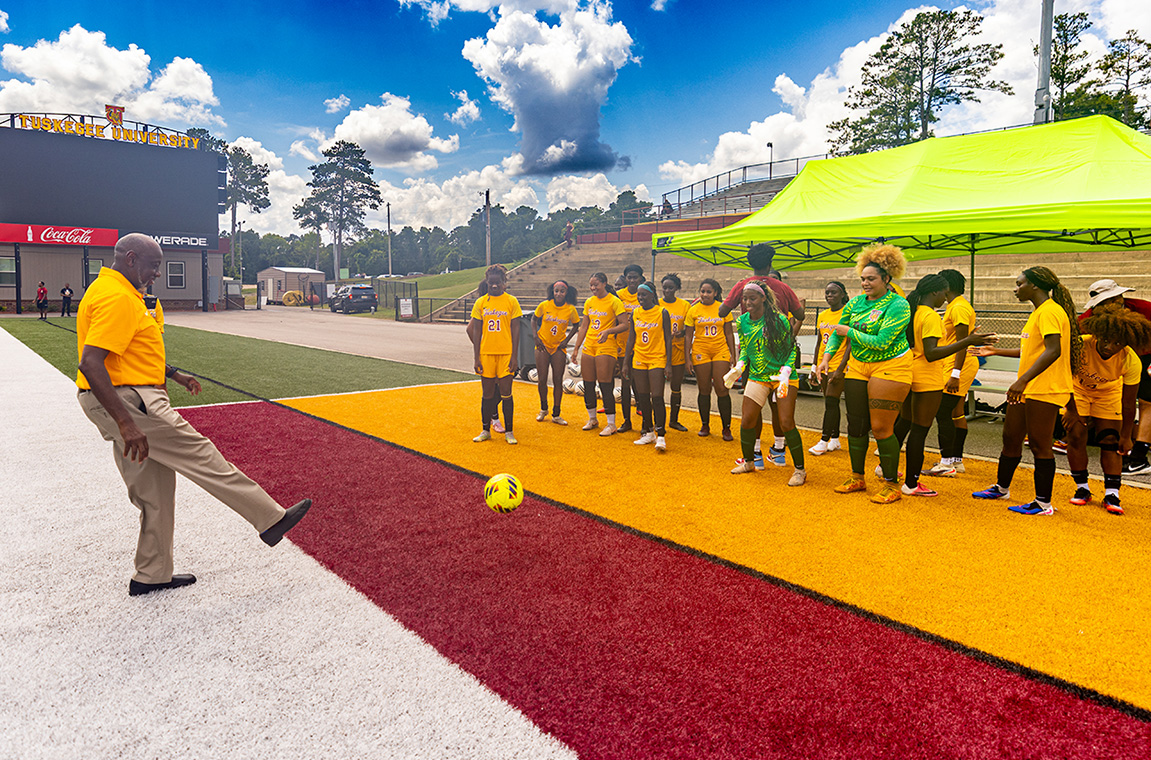 Dr. Brown kick ball with soccer team