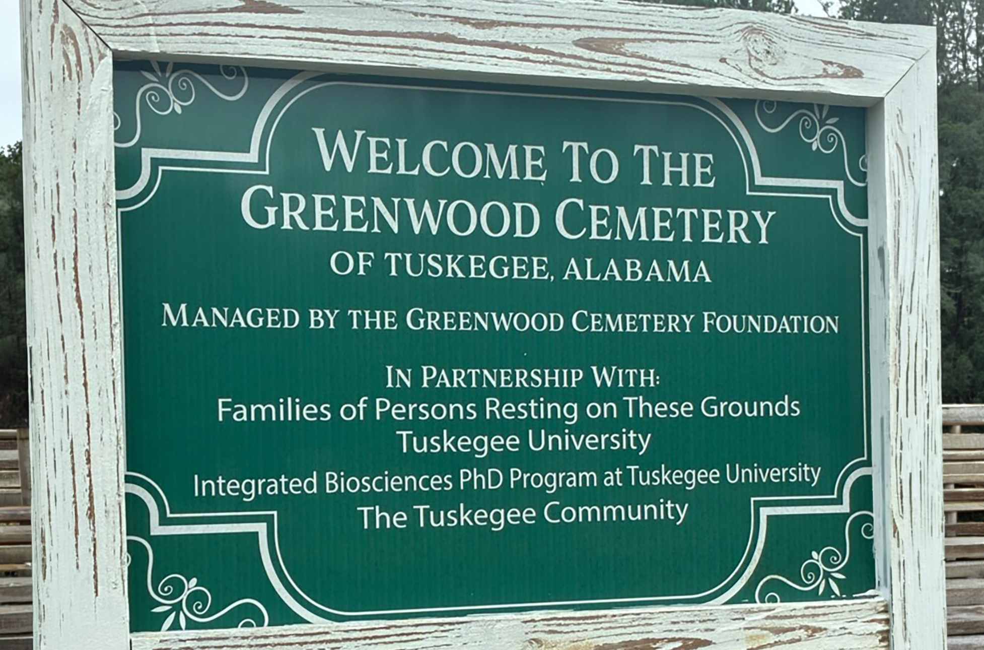 Cemetery sign containing name and partners