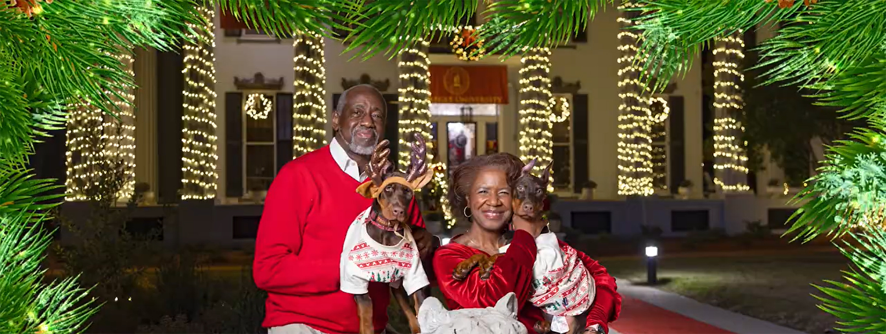 Dr. Mark Brown and Mrs. Gwen Brown with their two dogs