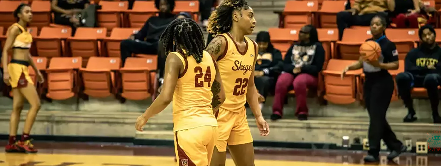 Tuskegee women basketball players on the court