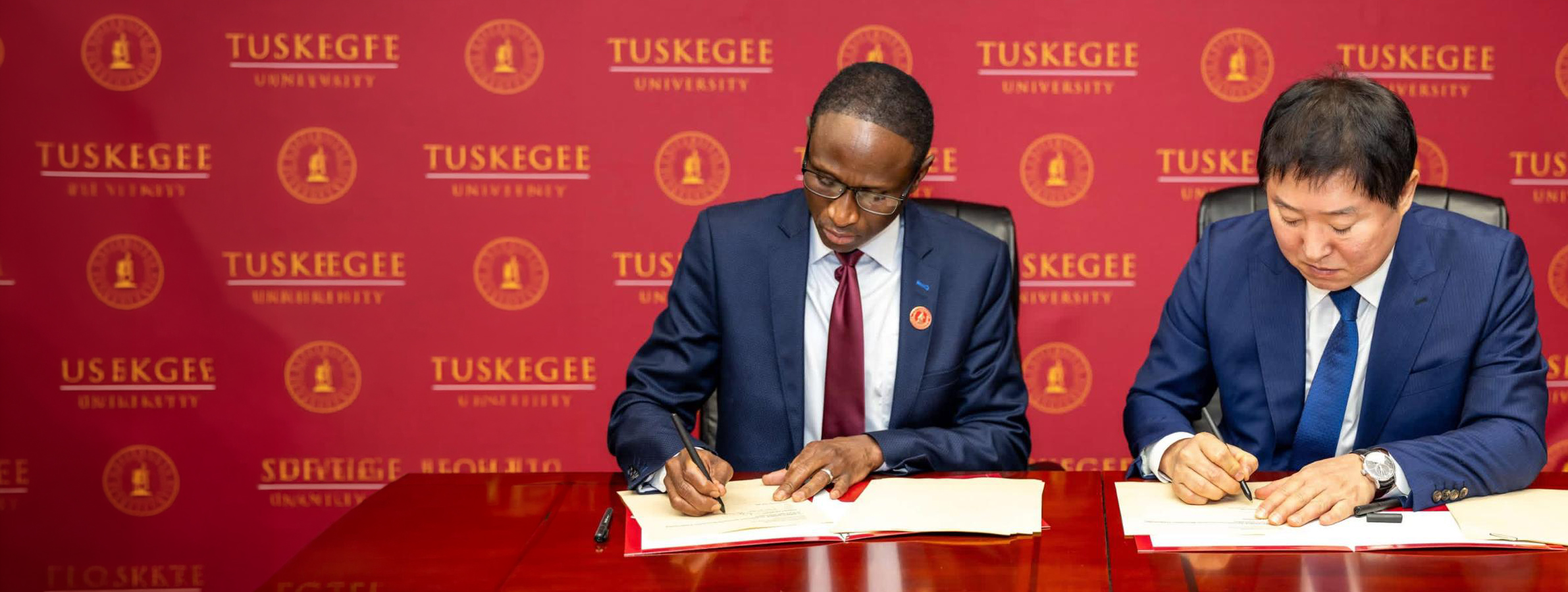 Dr. Thiam signing MOU with Samkee representative