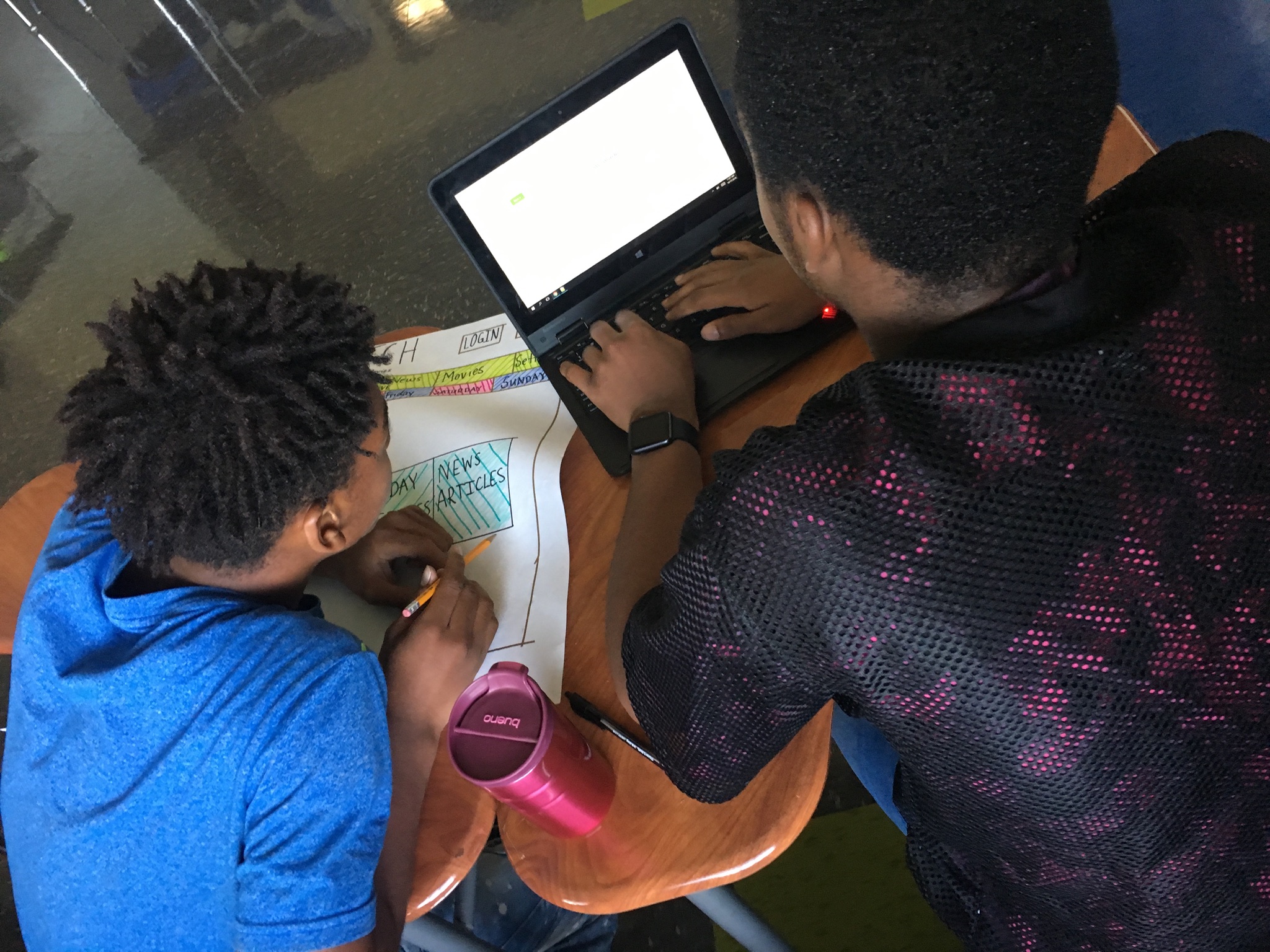 Two students working aon a design