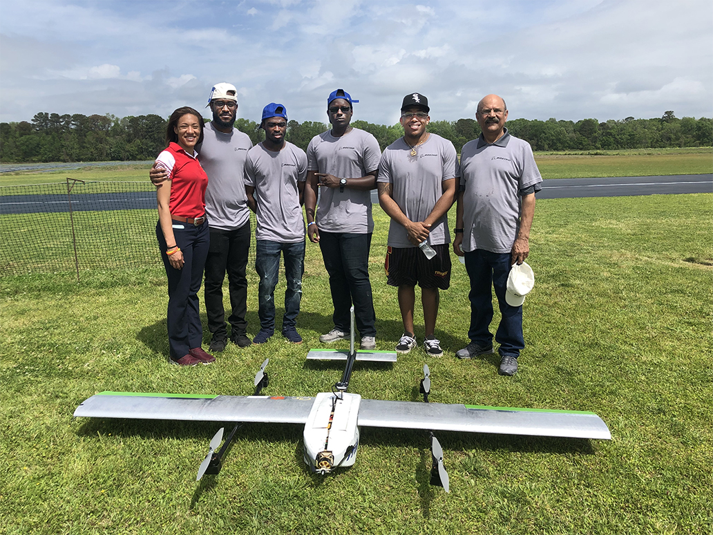 ASE Dean, Dr. Khan with students and glider