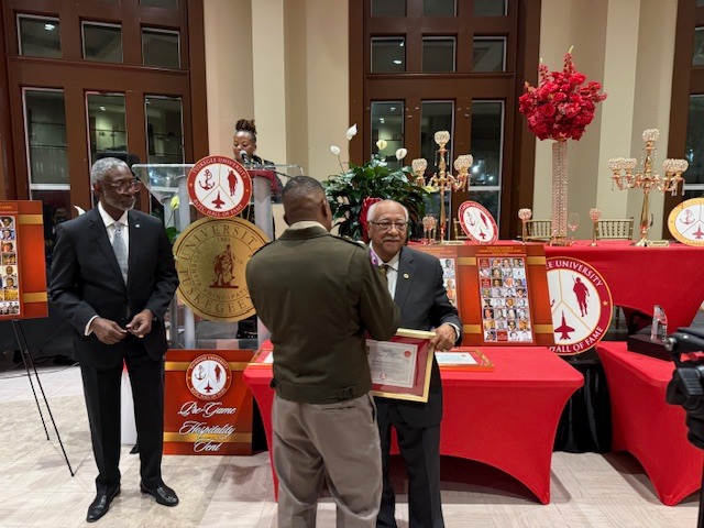 congratulating our alum