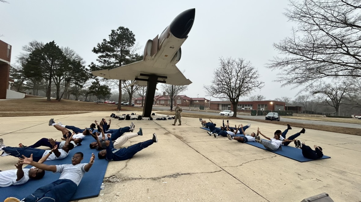 Cadets conduct a physical training session right next to Chappie's F-4 Phantom jet.