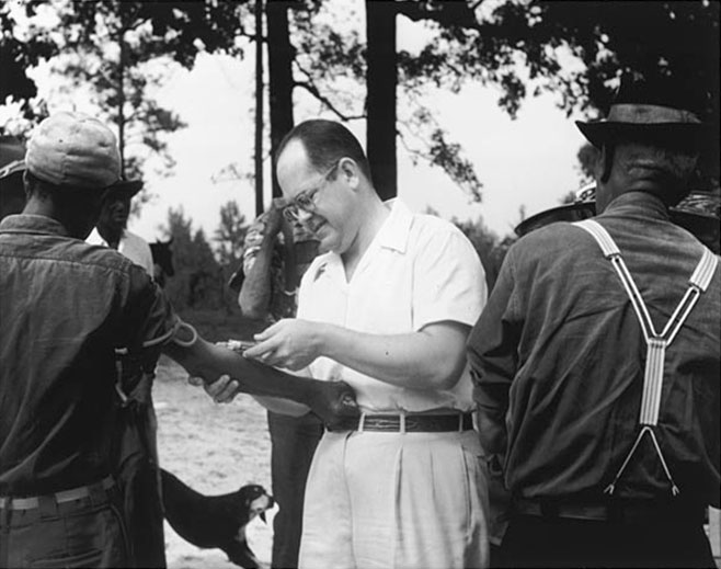USPHS doctor injecting an African American male