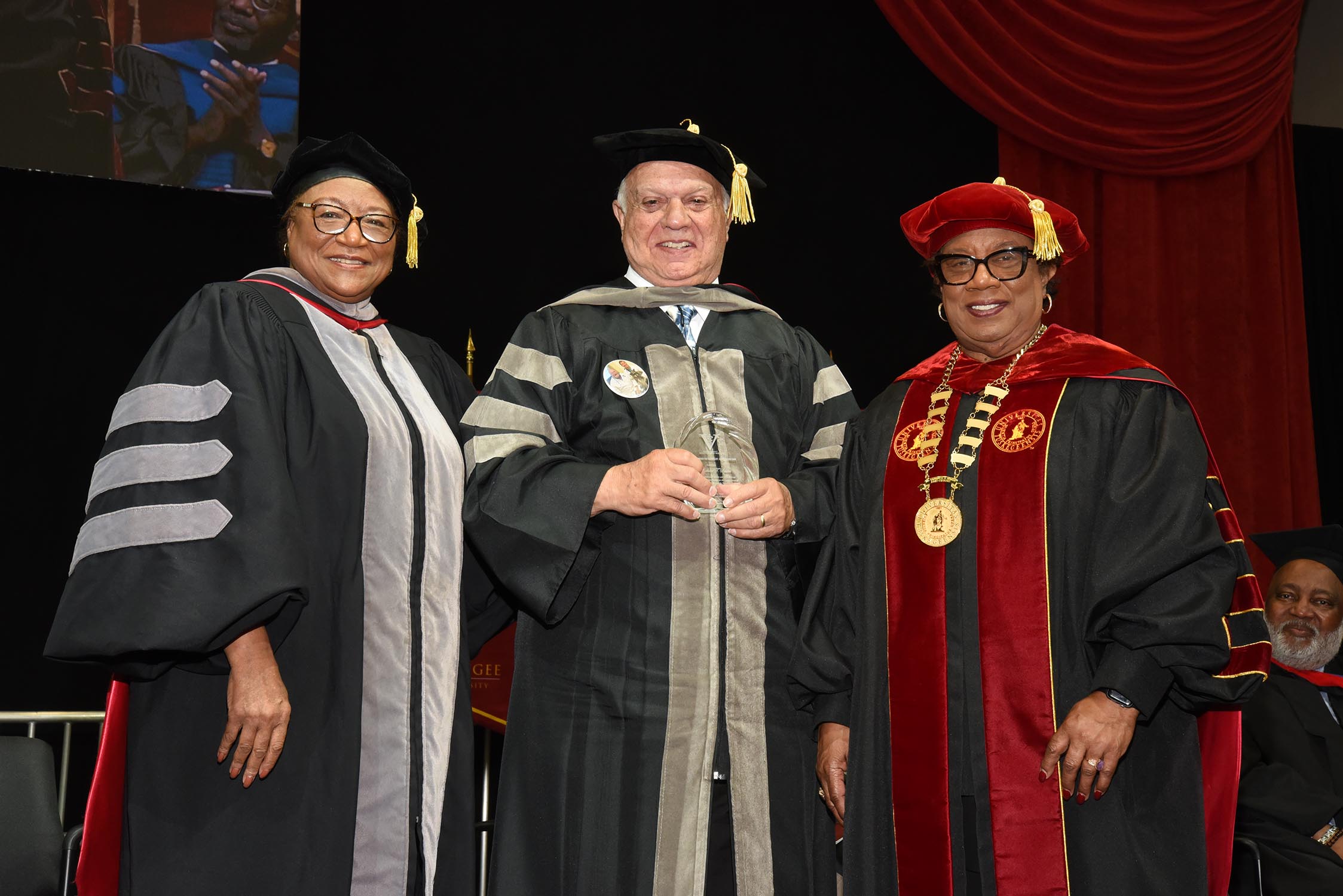 Dr. Richard Savino (center) receives award from Dean Perry and President Morris.