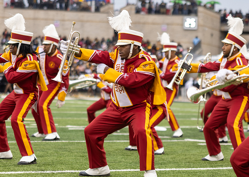 Marching Crimson Pipers Band performing on the field