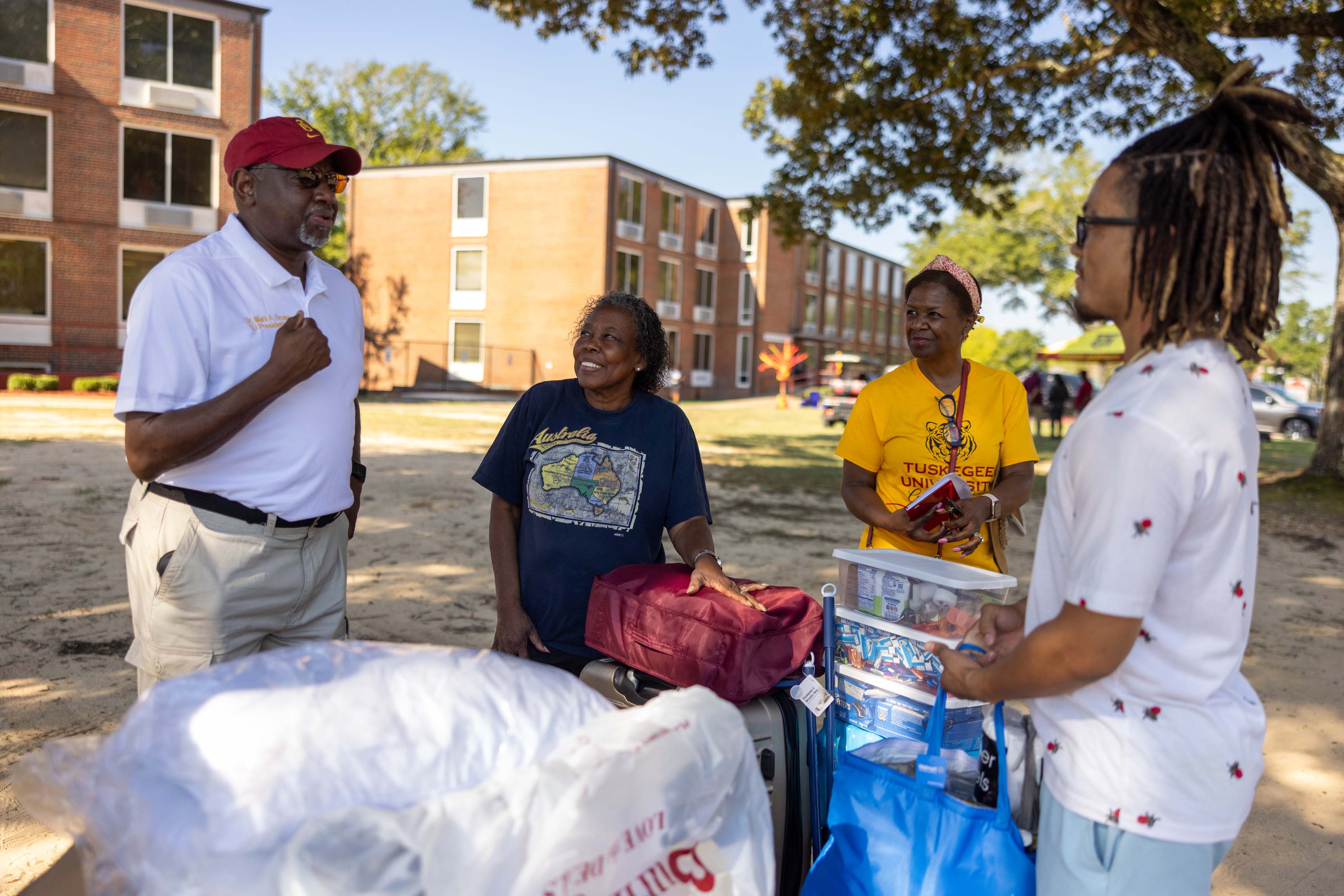 President Brown and First Lady talk with new student and parent.