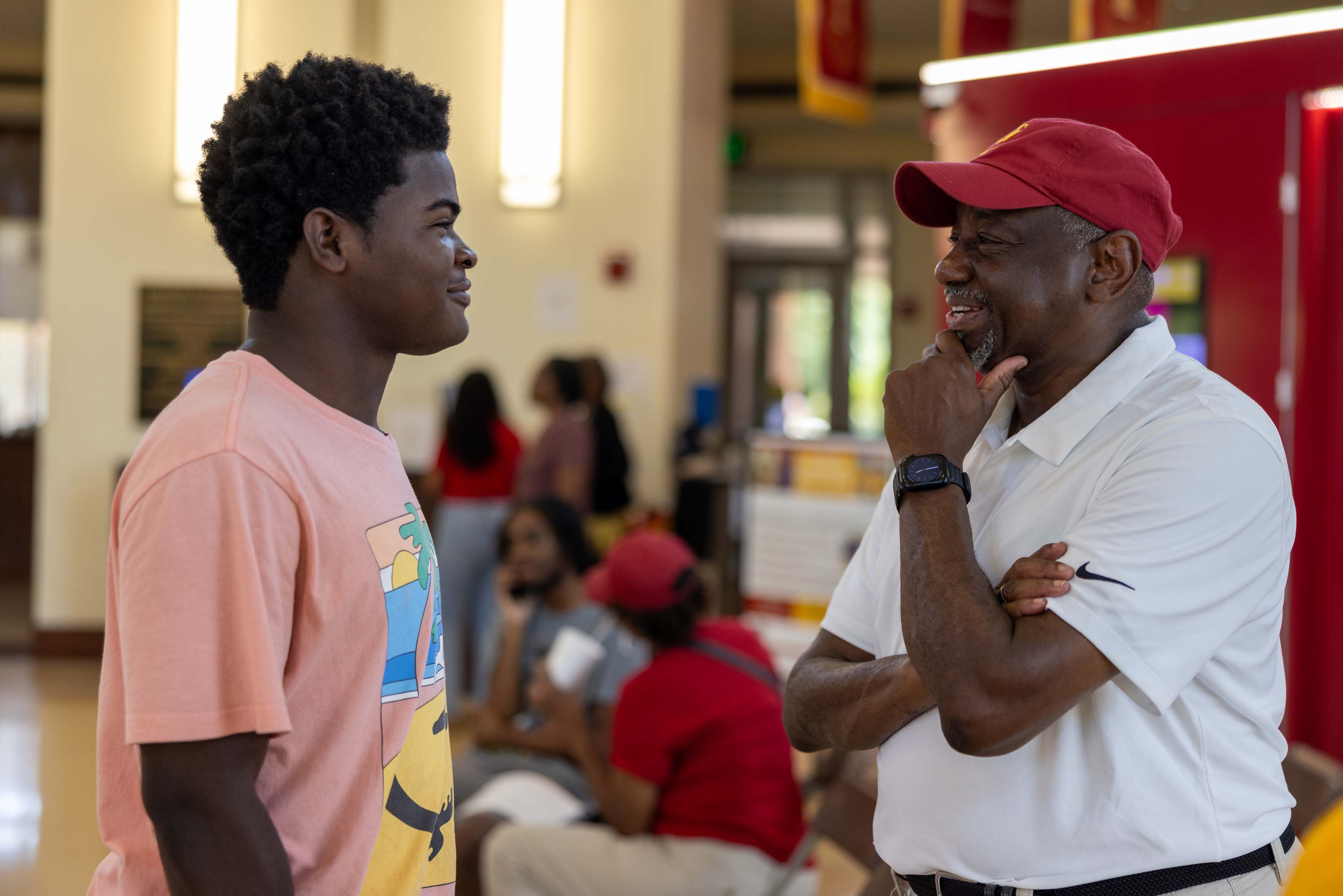 President Brown in conversation with new student.