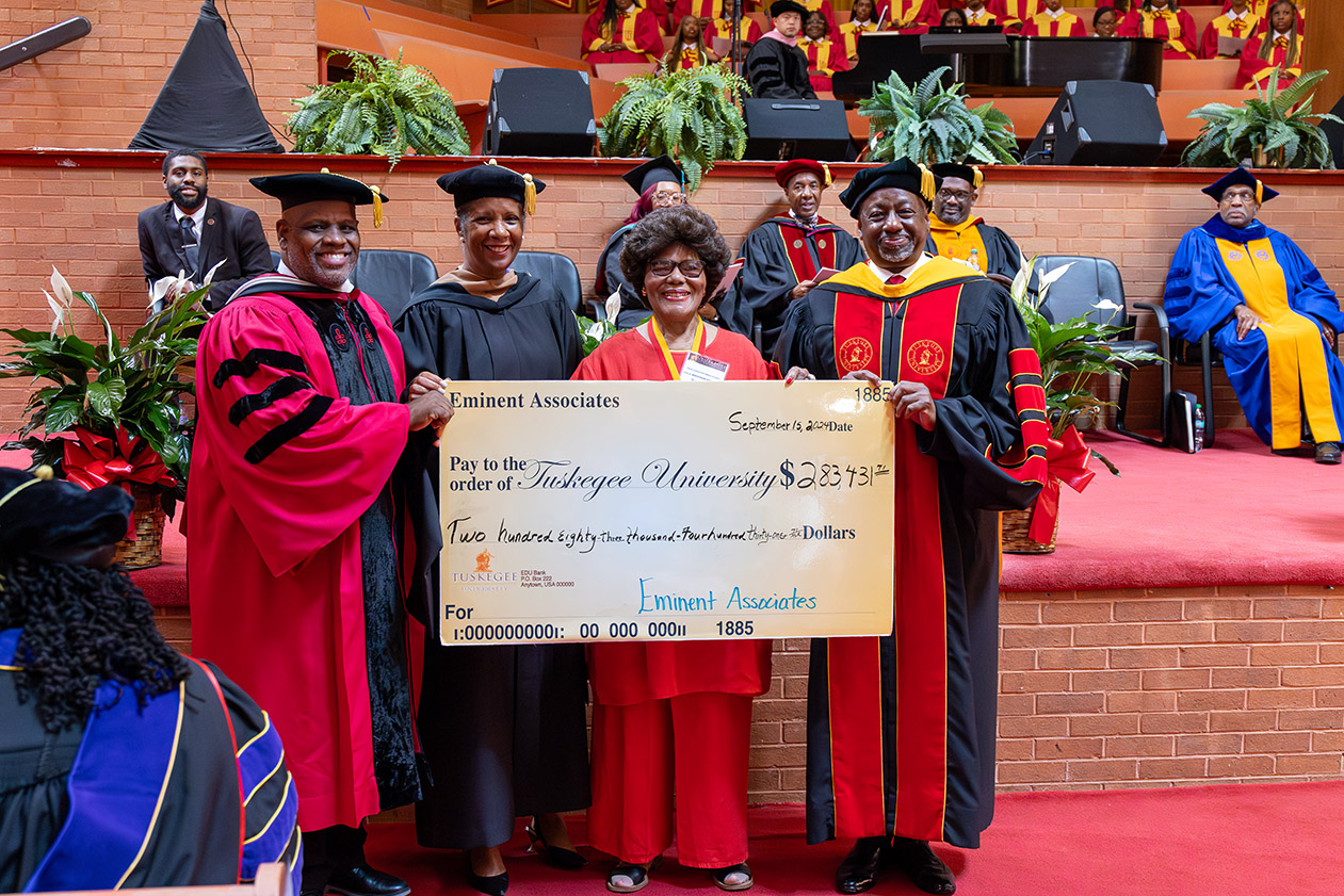 Check presentation from the Eminent Associates during Fall Convocation.