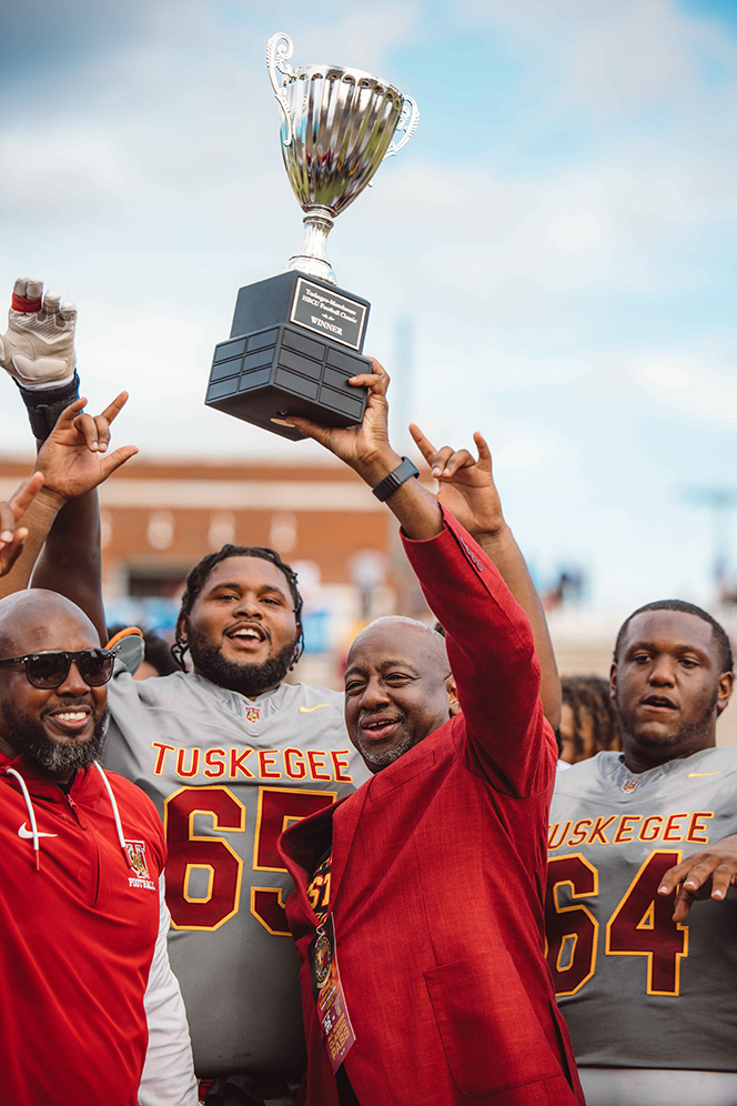 President Brown hoists the trophy.