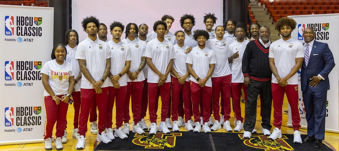 Tuskegee University Men's Basketball Team, head coach Benjy Taylor, and SIAC Commissioner Anthony Holloman.