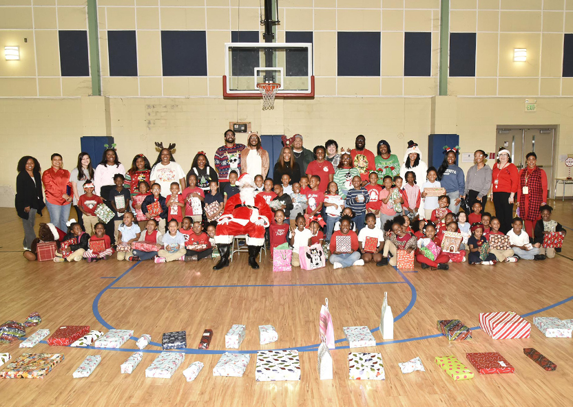 TUCVM’s Santa and helpers shared holiday cheer with GWC’s grade school students