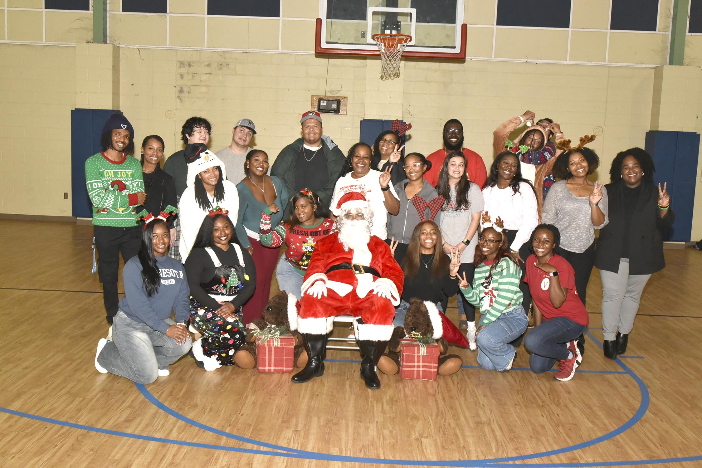 Santa and helpers at Vet Med Toy Drive at Carver Elementary School.