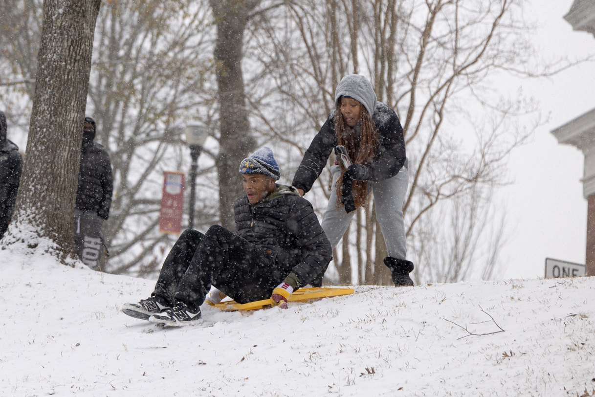 Students with makeshift sled.