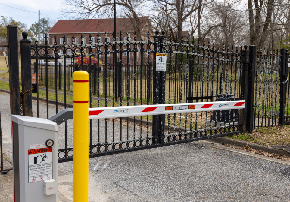 Campus entry gate with security arm extended.