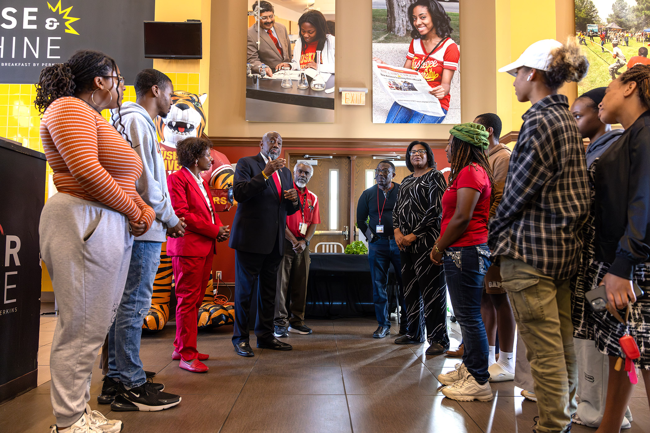 President Brown in the cafeteria with CAENS Dean and staff