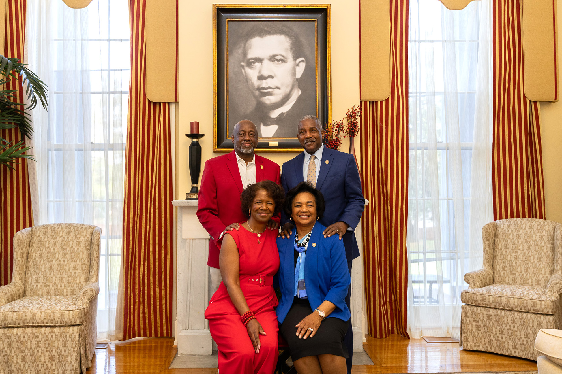 TU and HU presidents and first ladies in front of portrait of Dr. Booker T. Washington.