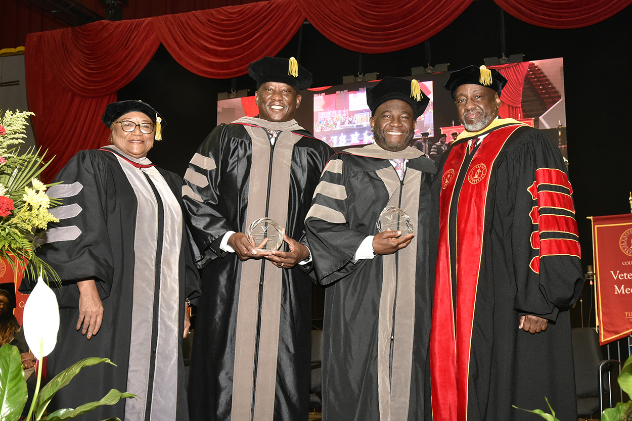 Dr Brown and Dean Perry with Critter Fixers doctors