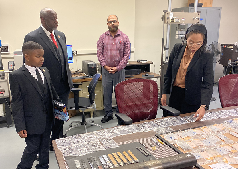 President Brown and Jaidyn visit another lab.