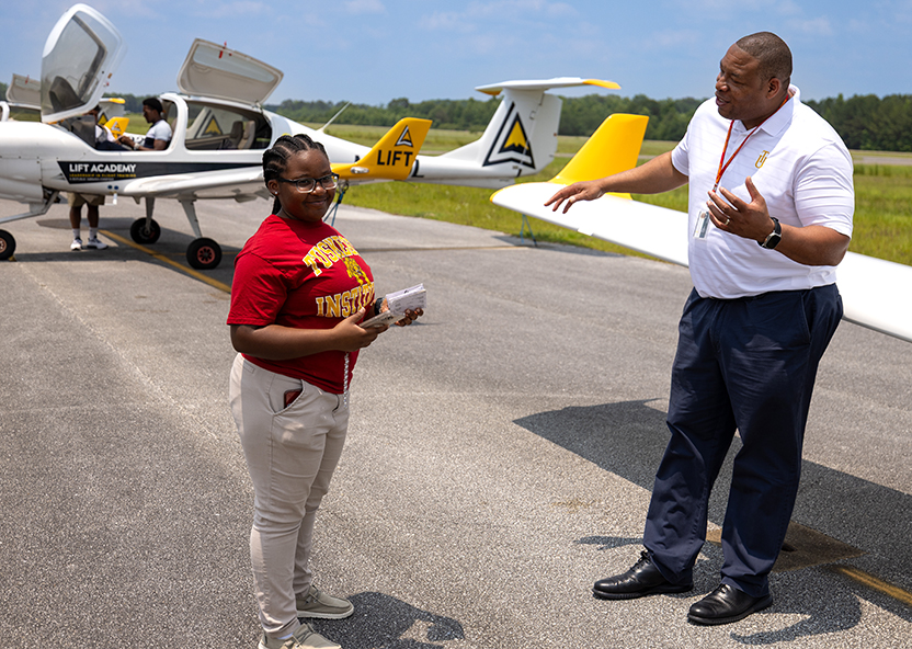 Student talks with program director