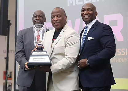 Brown, Ruffin, and Holloman with the award.
