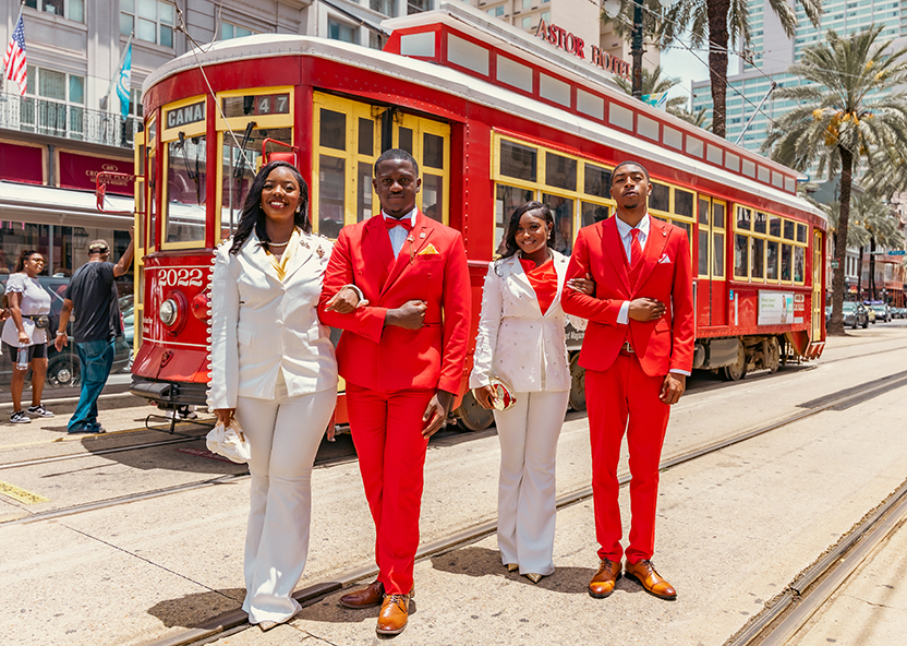 TU Royal Court standing in front of a trolley