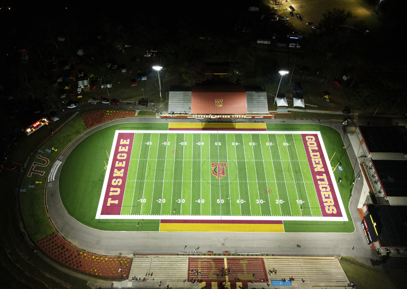 Picture of football field lit up at night 