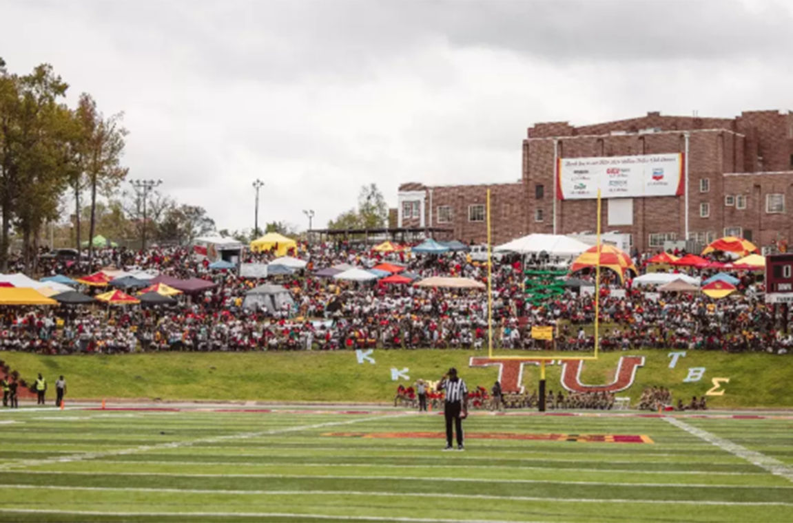Shoeing end of football field with fans