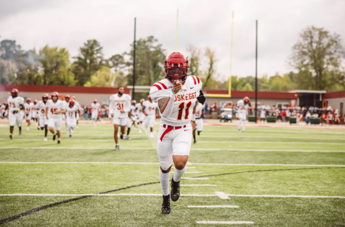 Football players running onto the field