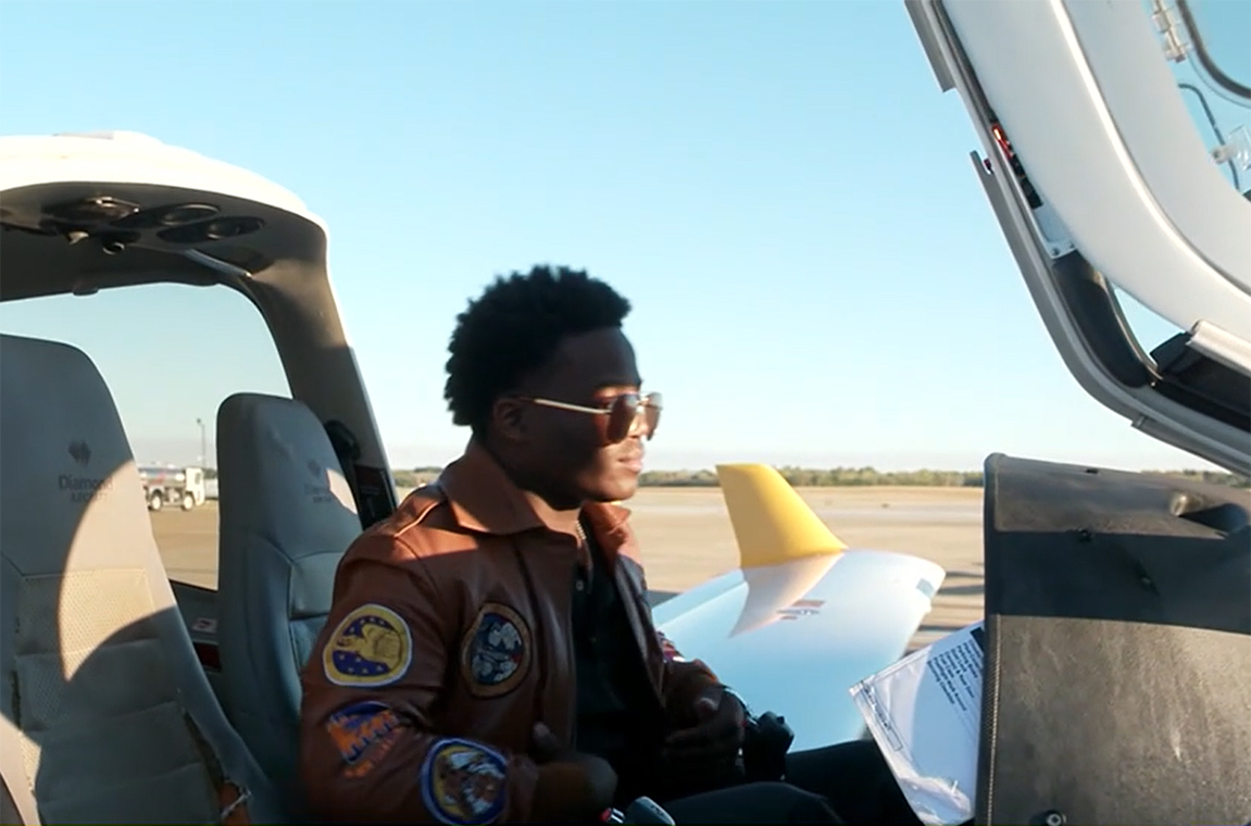 Aviation Science student Isaiah Hand in cockpit of plane