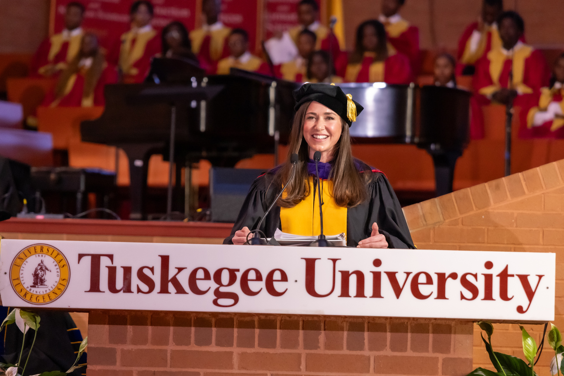 Senator Katie Britt at the podium during Homecoming 2025 Convocation