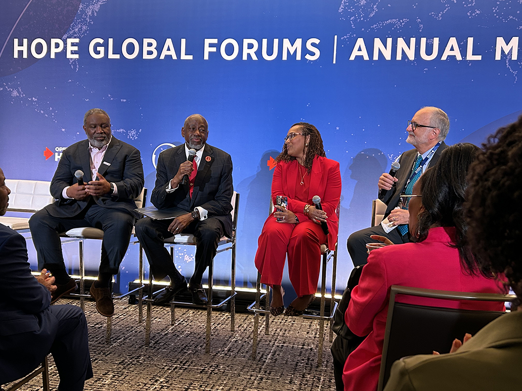Dr. Mark Brown seated with other HOPE Global Forums panelists