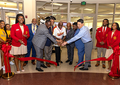 Officials cutting ribbon at grand opening