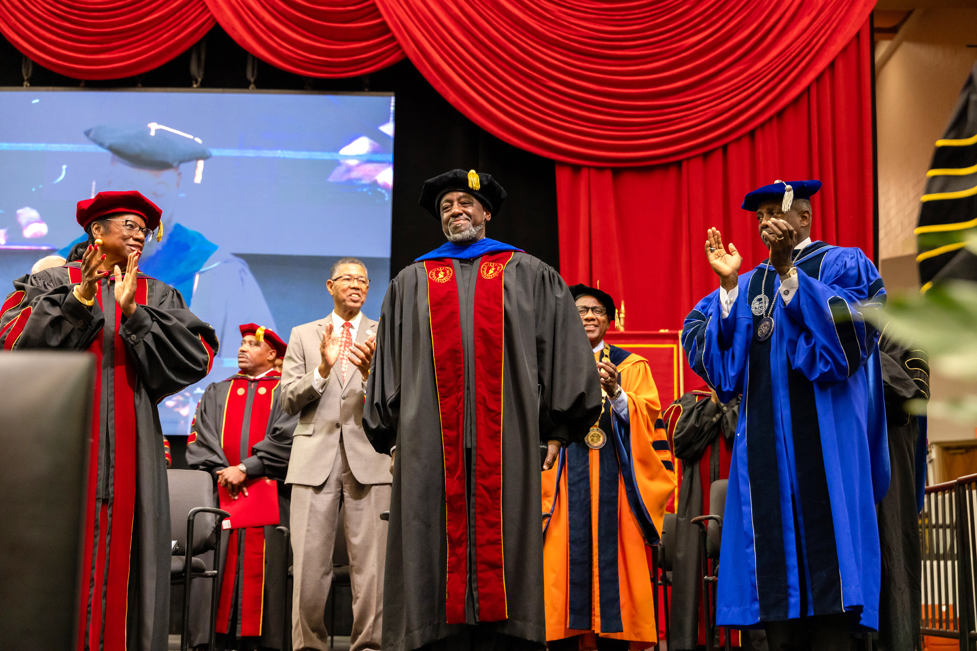 TU President Dr. Mark A. Brown receives congratulatory applause on investiture ceremony stage