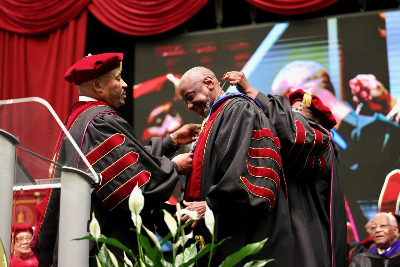 Dr. Brown being presented with presidental medallion
